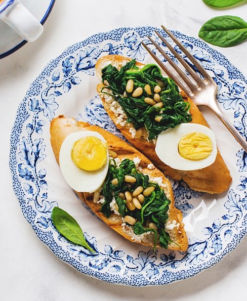 Fried spinach, egg and pine nut sandwiches